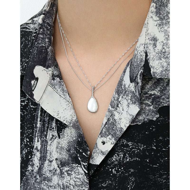 Elegant Waterdrop Mother of Shell 925 Sterling Silver NecklaceMain Stone: Mother of Shell
Main Stone Quantity: 1 
Pendant Size: 30mm * 13mm 
Metal Material: Solid 925 Sterling Silver
Metal Electroplating: Rhodium
Chain Length: JEWELLYJEWELLYShell 925 Sterling Silver Necklace