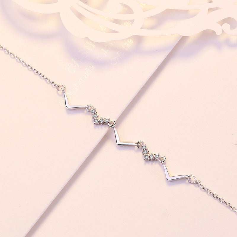 Girl CZ V Shape Wave 925 Sterling Silver BraceletMetal Material: Solid 925 Sterling Silver
Accent Stone: AAA Cubic Zirconia
Metal Electroplating: Rose Gold/Rhodium
Chain Length: 170mm + 40mm Adjustable
Total WeightJEWELLYJEWELLYShape Wave 925 Sterling Silver Bracelet