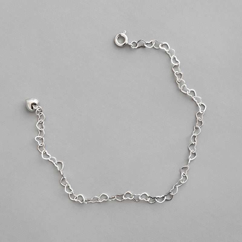 Girl Hollow Heart To Heart 925 Sterling Silver BraceletPendant Size: 3.7m 
Metal Material: Solid 925 Sterling Silver
Metal Electroplating: Rhodium
Chain Length: 195mm
Total Weight: 2gJEWELLYJEWELLYHeart 925 Sterling Silver Bracelet