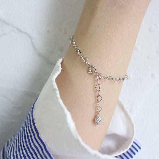 Girl Hollow Heart To Heart 925 Sterling Silver BraceletPendant Size: 3.7m 
Metal Material: Solid 925 Sterling Silver
Metal Electroplating: Rhodium
Chain Length: 195mm
Total Weight: 2gJEWELLYJEWELLYHeart 925 Sterling Silver Bracelet