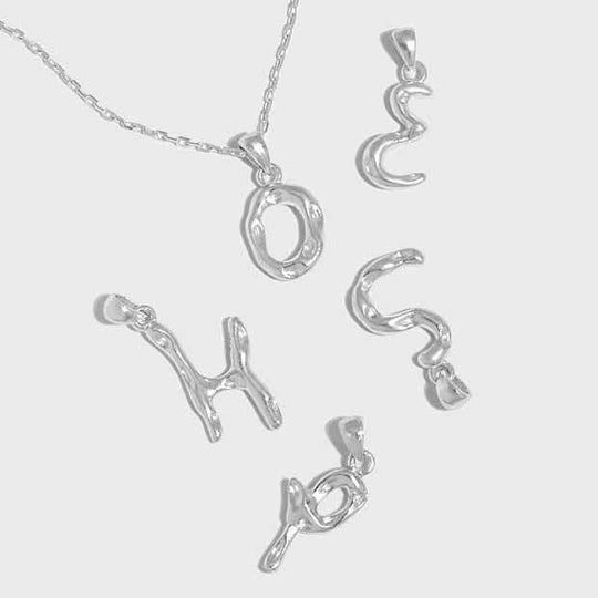 Simple Irregular Letters A-Z 925 Sterling Silver PendantPendantA-Z Size: 12mm - 16mm 
Chain Width: 1.45mm 
Metal Material: Solid 925 Sterling Silver
Metal Electroplating: 18K Yellow Gold/Rhodium
Chain Length: 390mm + JEWELLYJEWELLY925 Sterling Silver Pendant